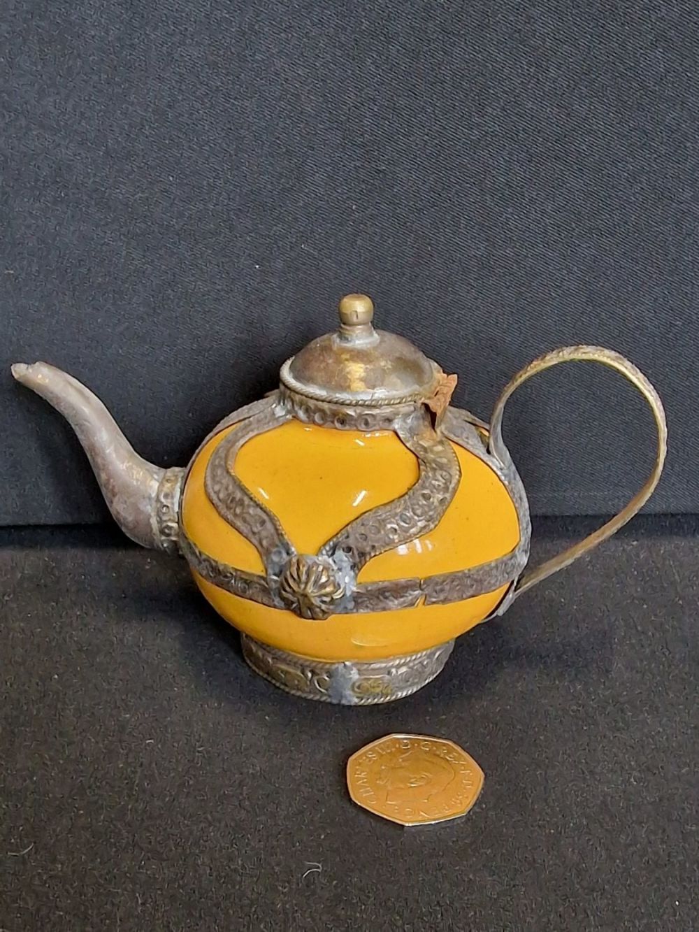 Lot 325: Small middle Eastern tea pot. Brass outer design...