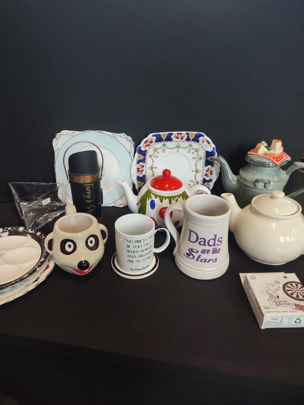 Lot 347: Collection of tea pots, mugs and plates including...