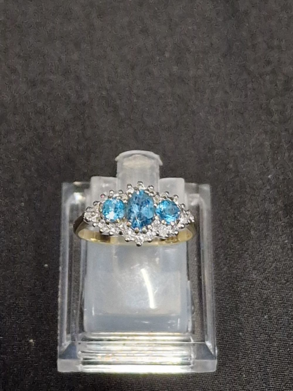 Lot 451: Ladies 9ct hallmarked ring. With three Topaz's and...