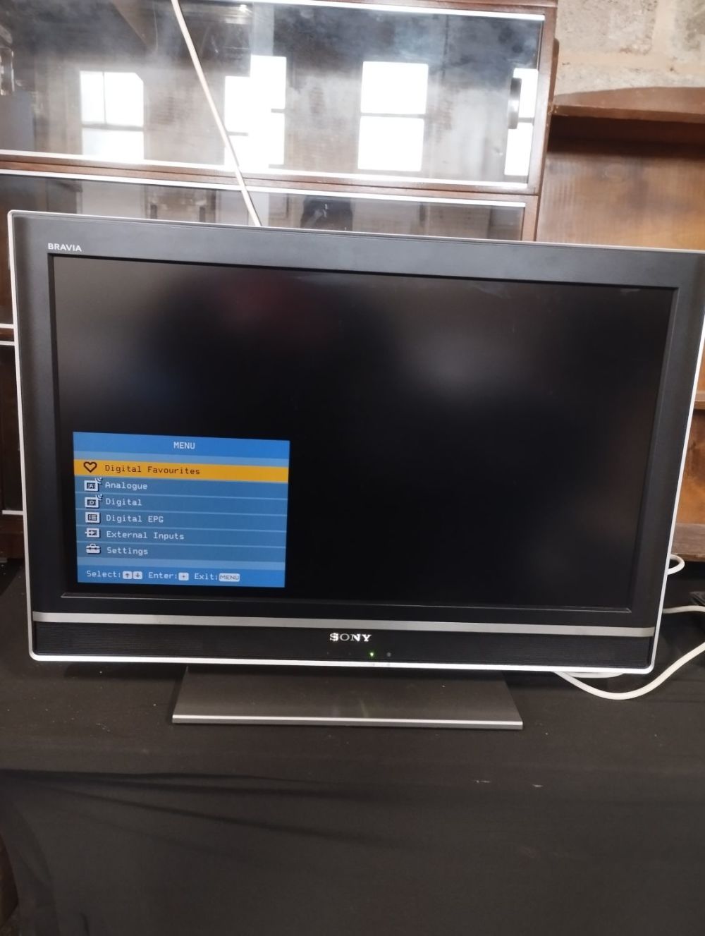 Lot 154: Sony LCD 32" Flatscreen TV with Remote and...