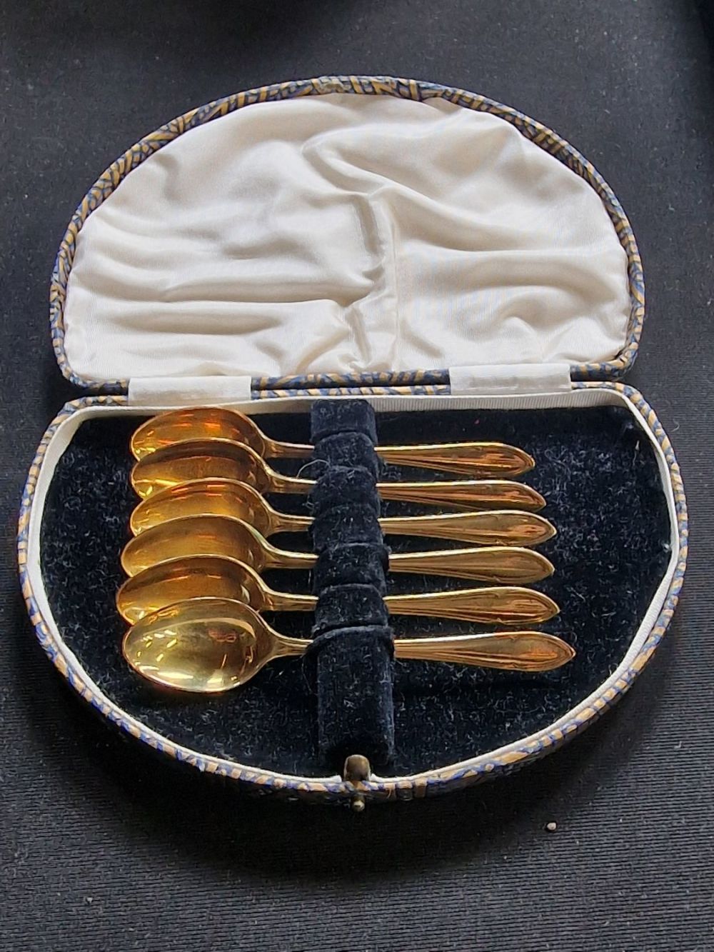 Lot 180: A Antique set of brass Rodgers sugar spoons....
