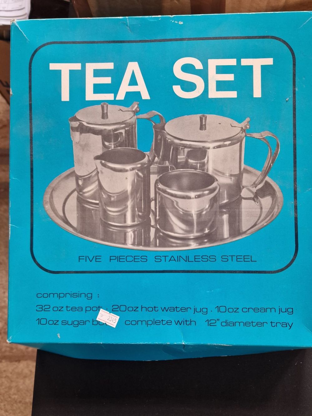 Lot 181: A vintage unused stainless five piece tea set