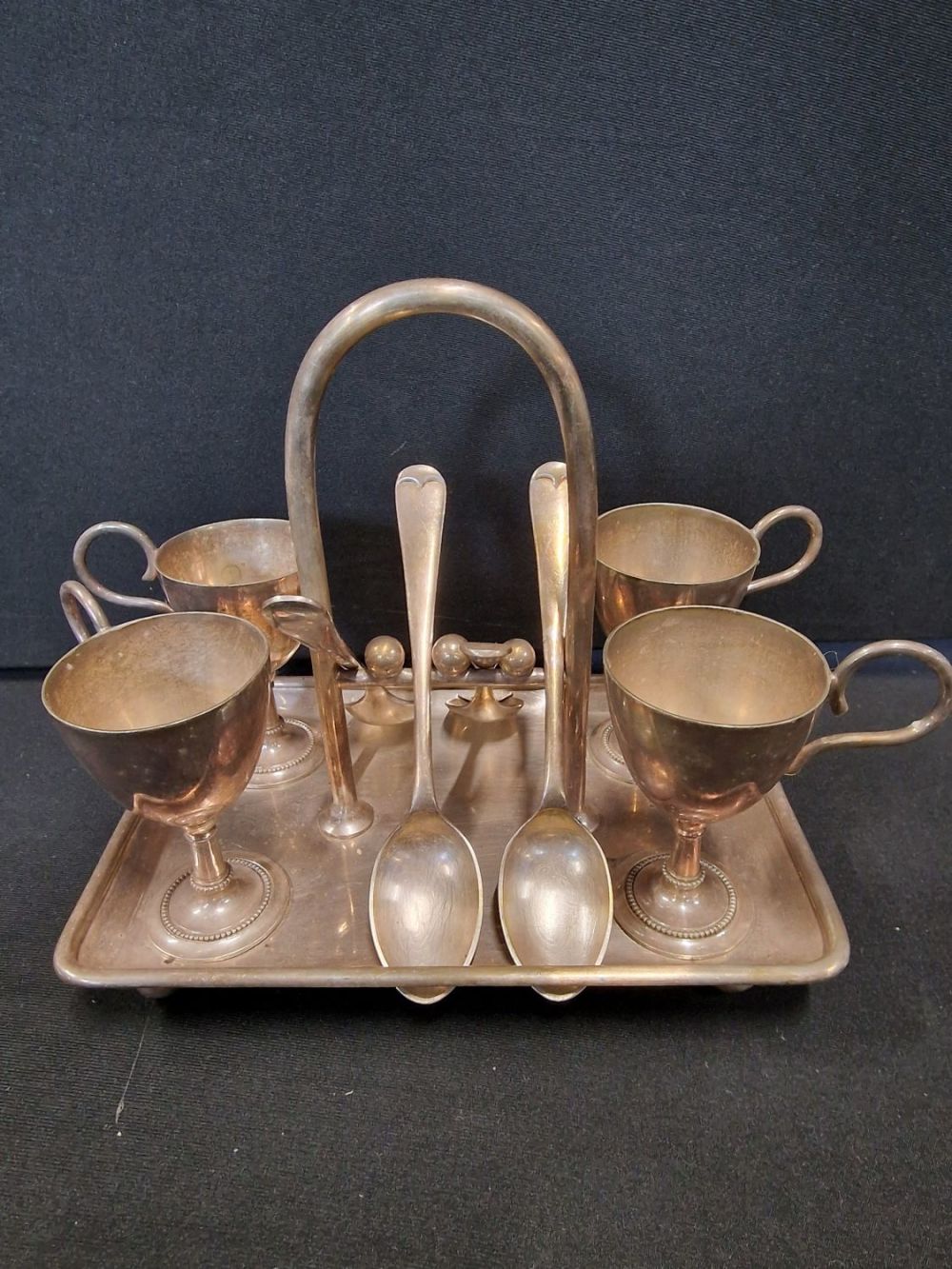 Lot 318: Vintgae silver plate breakfast set - four egg...