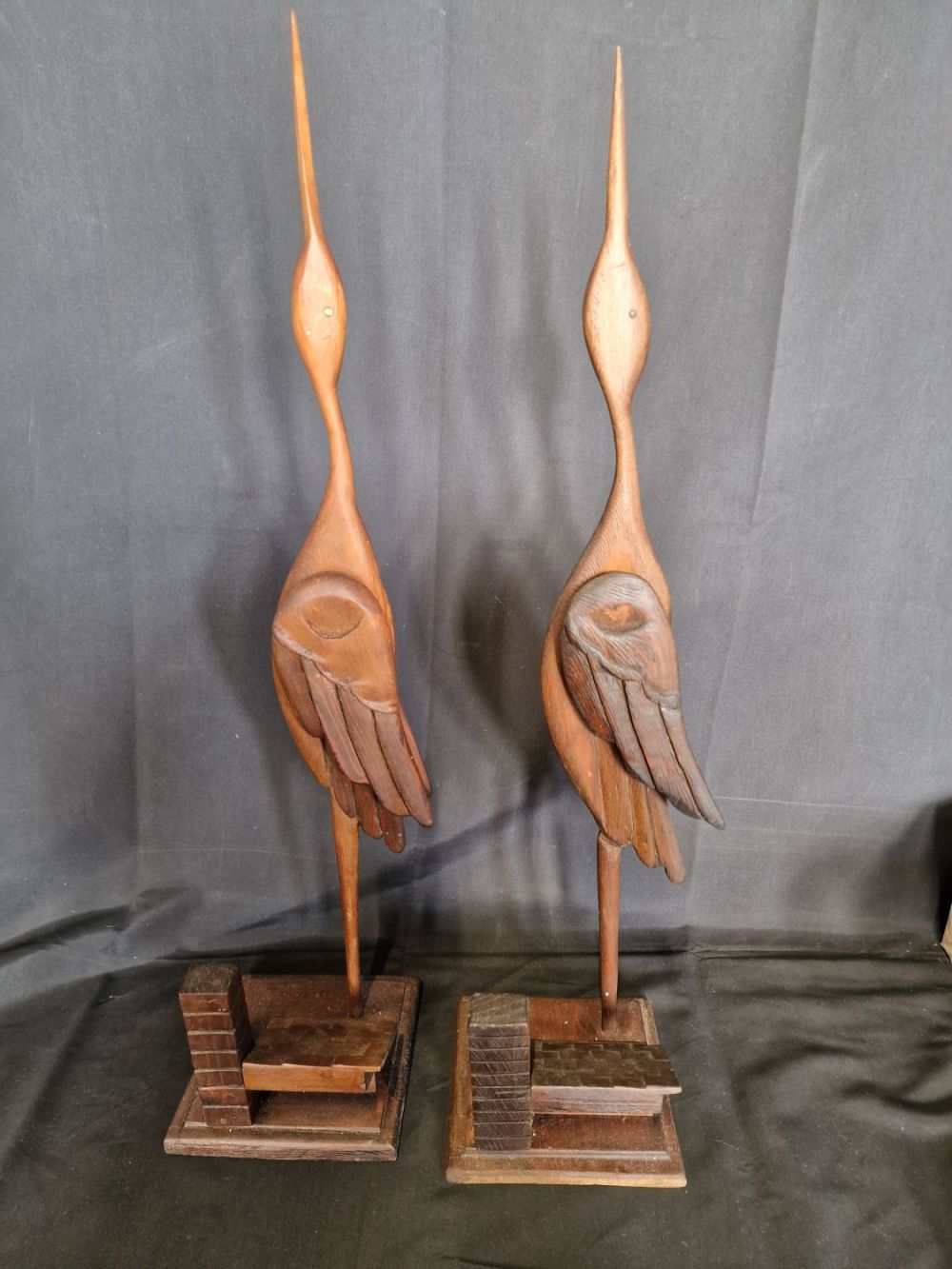 Lot 353: Two hand made wooden storks on roof top....