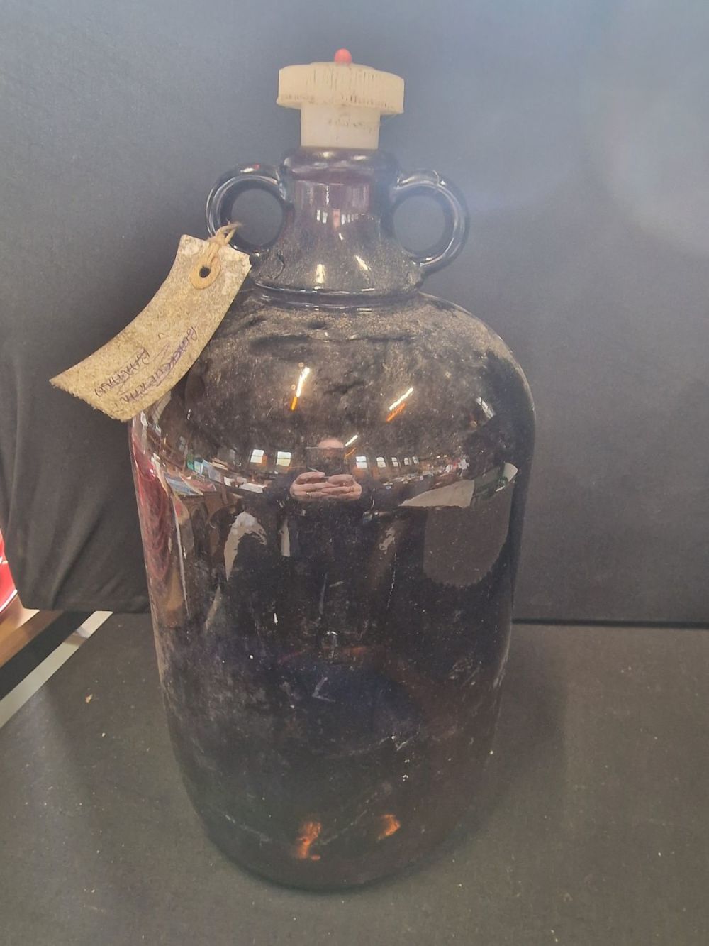 Lot 389: A brown glass demijohn