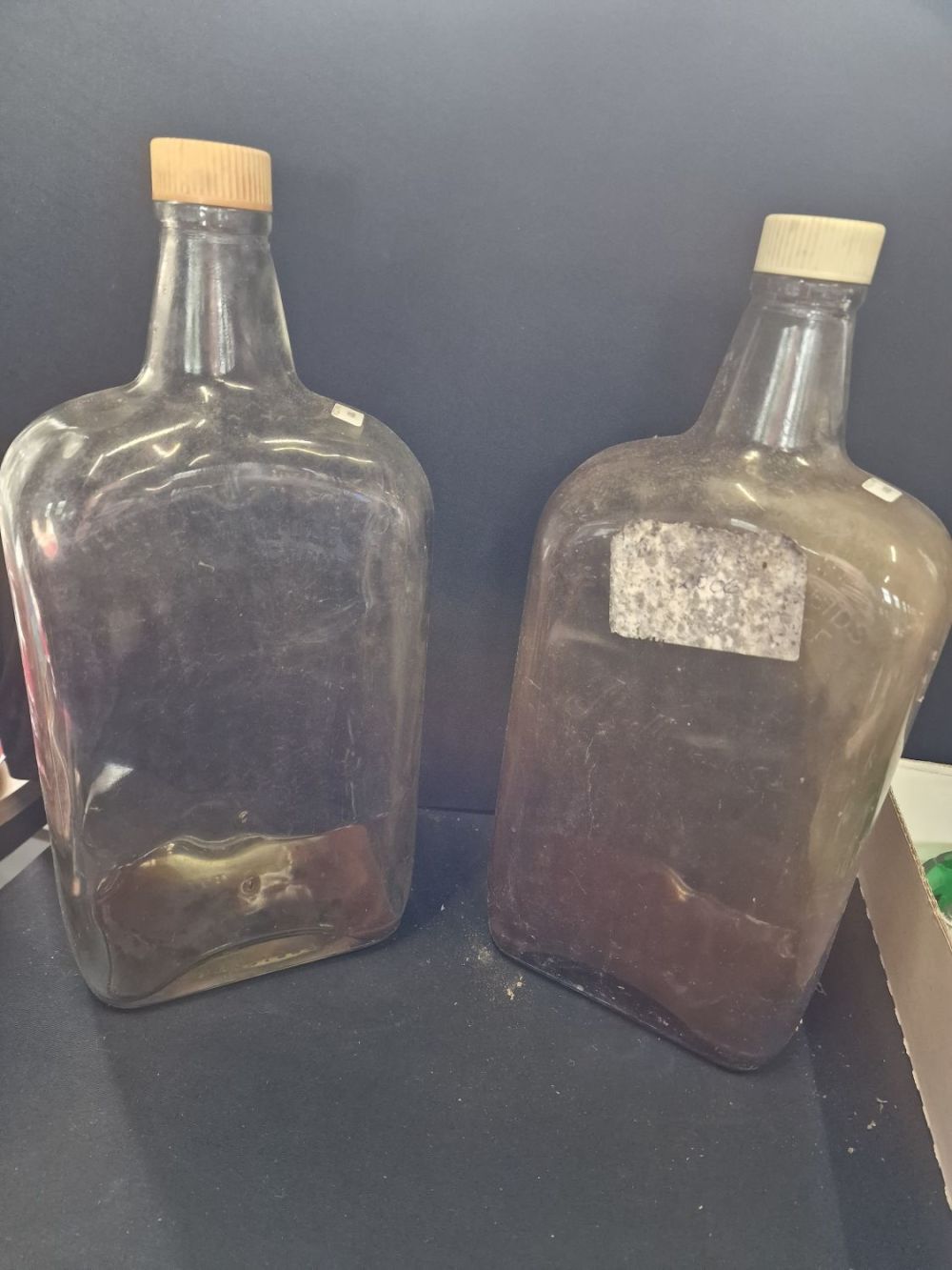 Lot 390: Two large glass storage bottles with inscriptions 'federal...