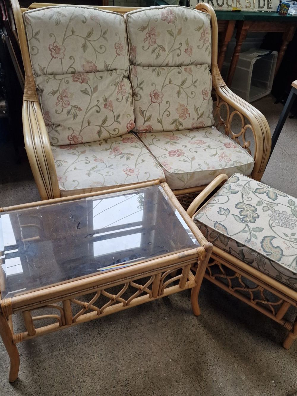 Lot 392: Three piece conservatory set. Two seater sofa, table...