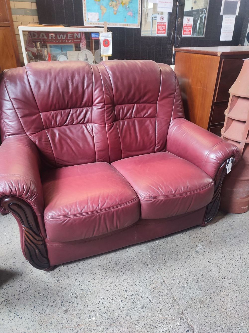 Lot 401: Burgundy leather 2 seater sofa