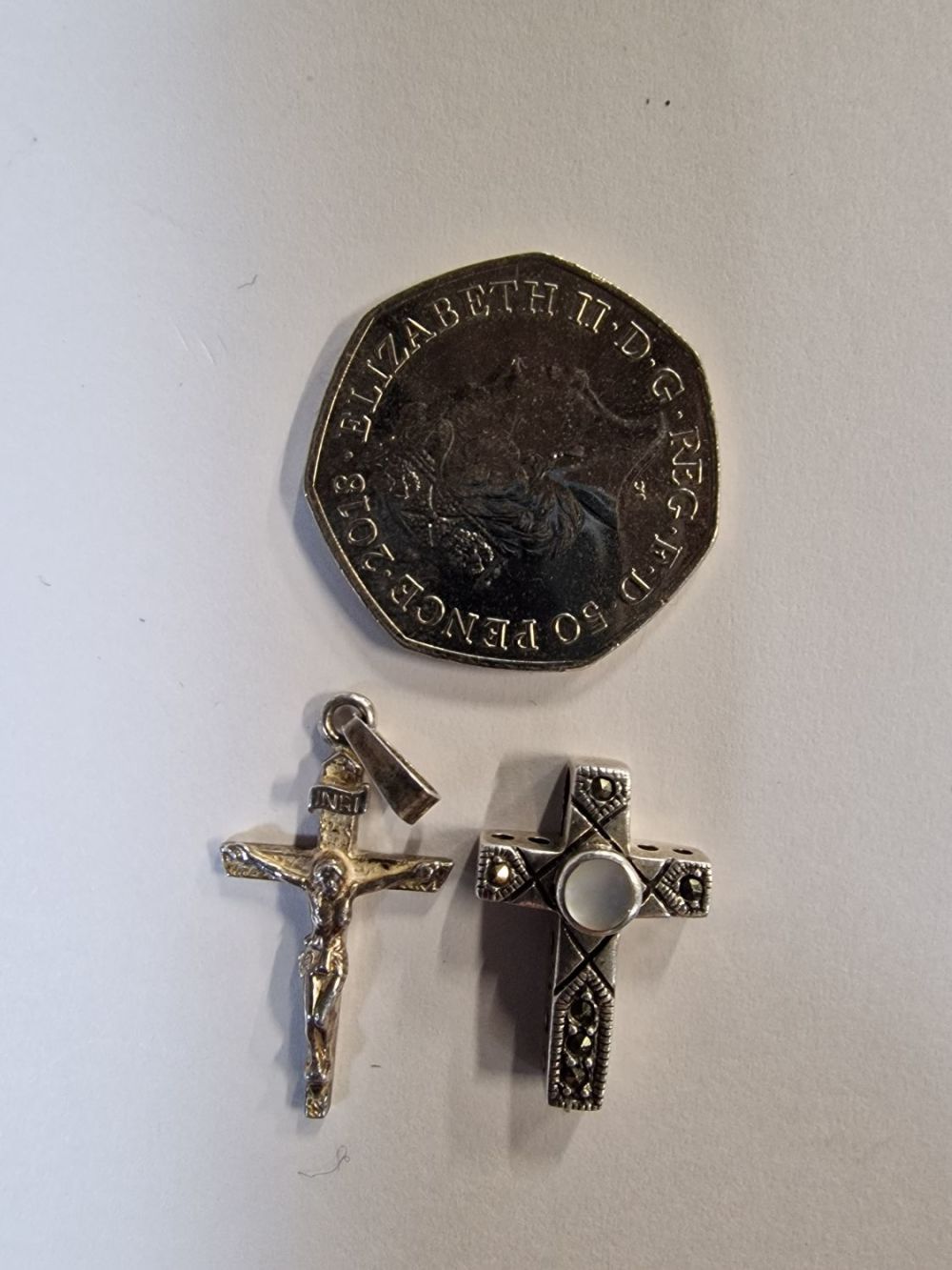Lot 413: Two sterling silver vintage crucifix.