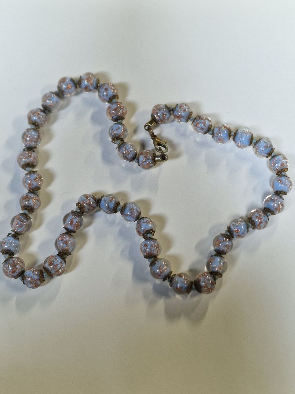Lot 414: A.stunning set of Glass wedding cake beads. Gold...