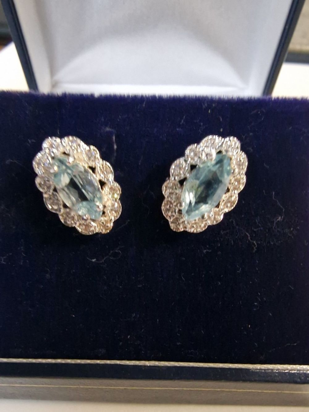 Lot 422: Blue Topaz and CZ earings