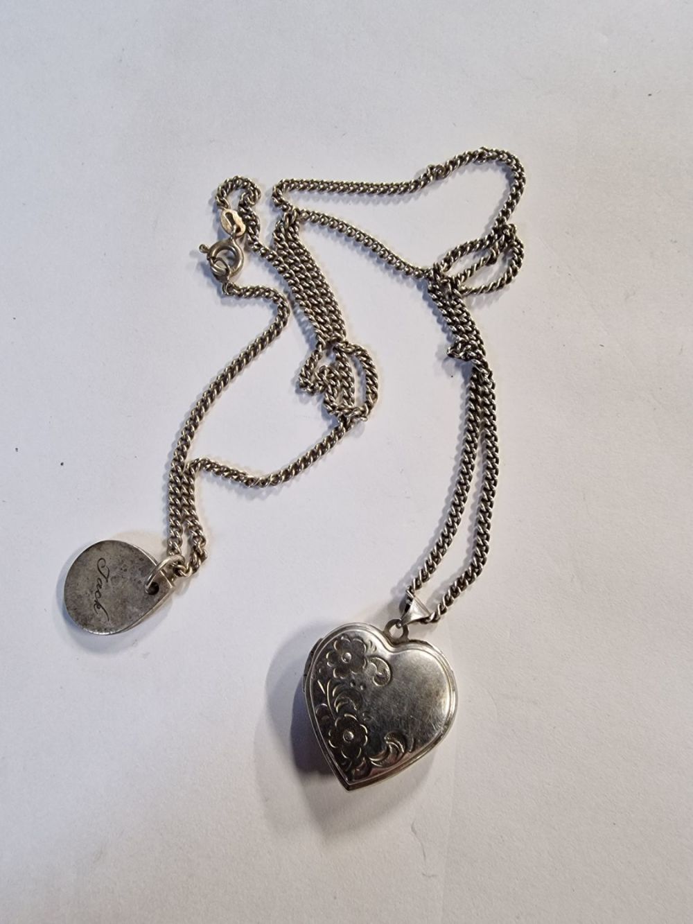 Lot 427: A sterling silver heart lock and a sterling...