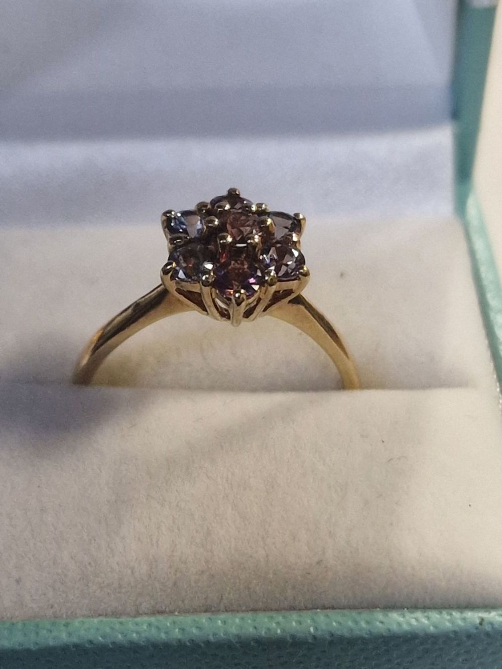 Lot 428: A purple and pale blue stone set in...