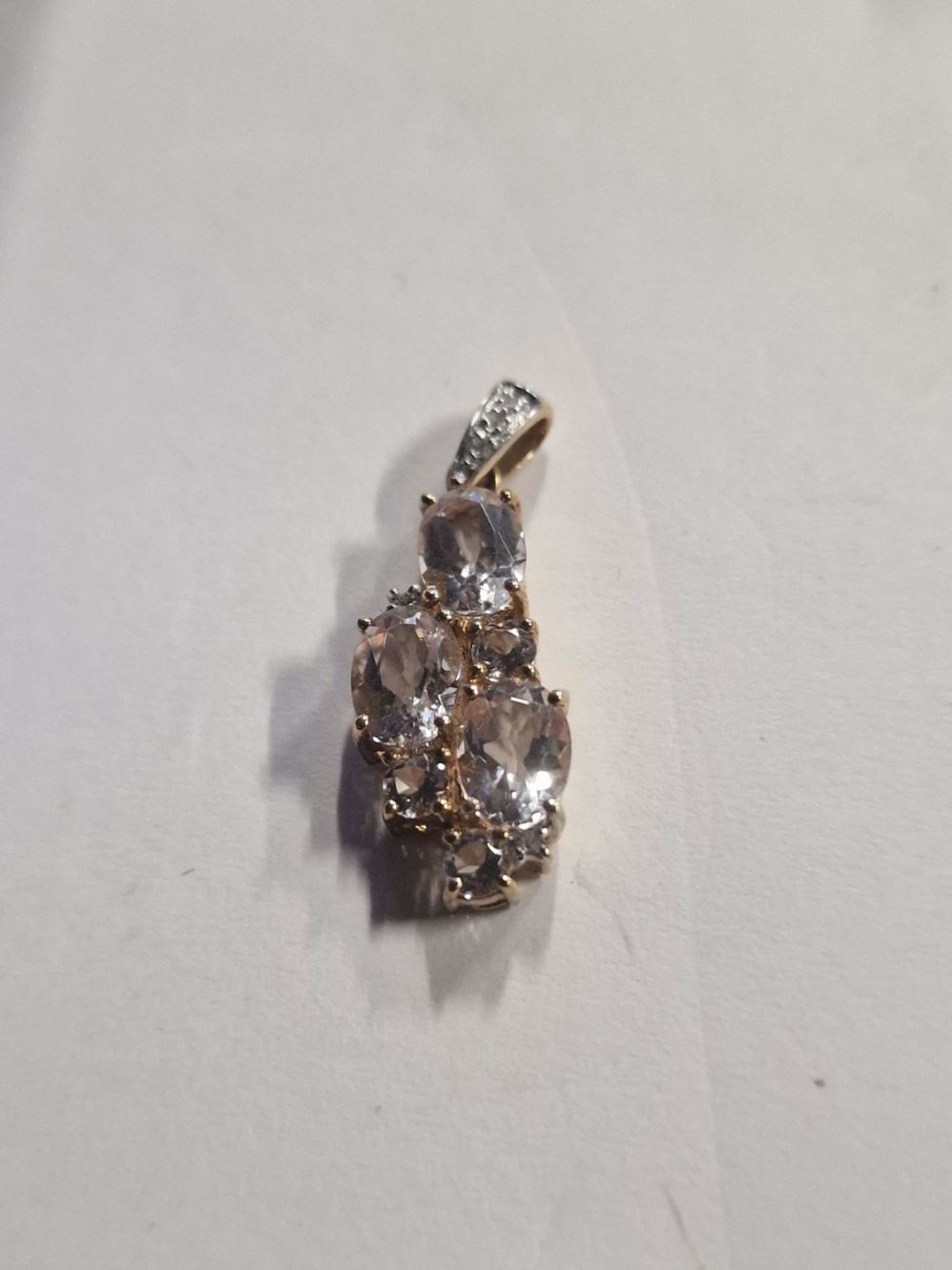 Lot 429: 9ct gold pendant with diamonique stones