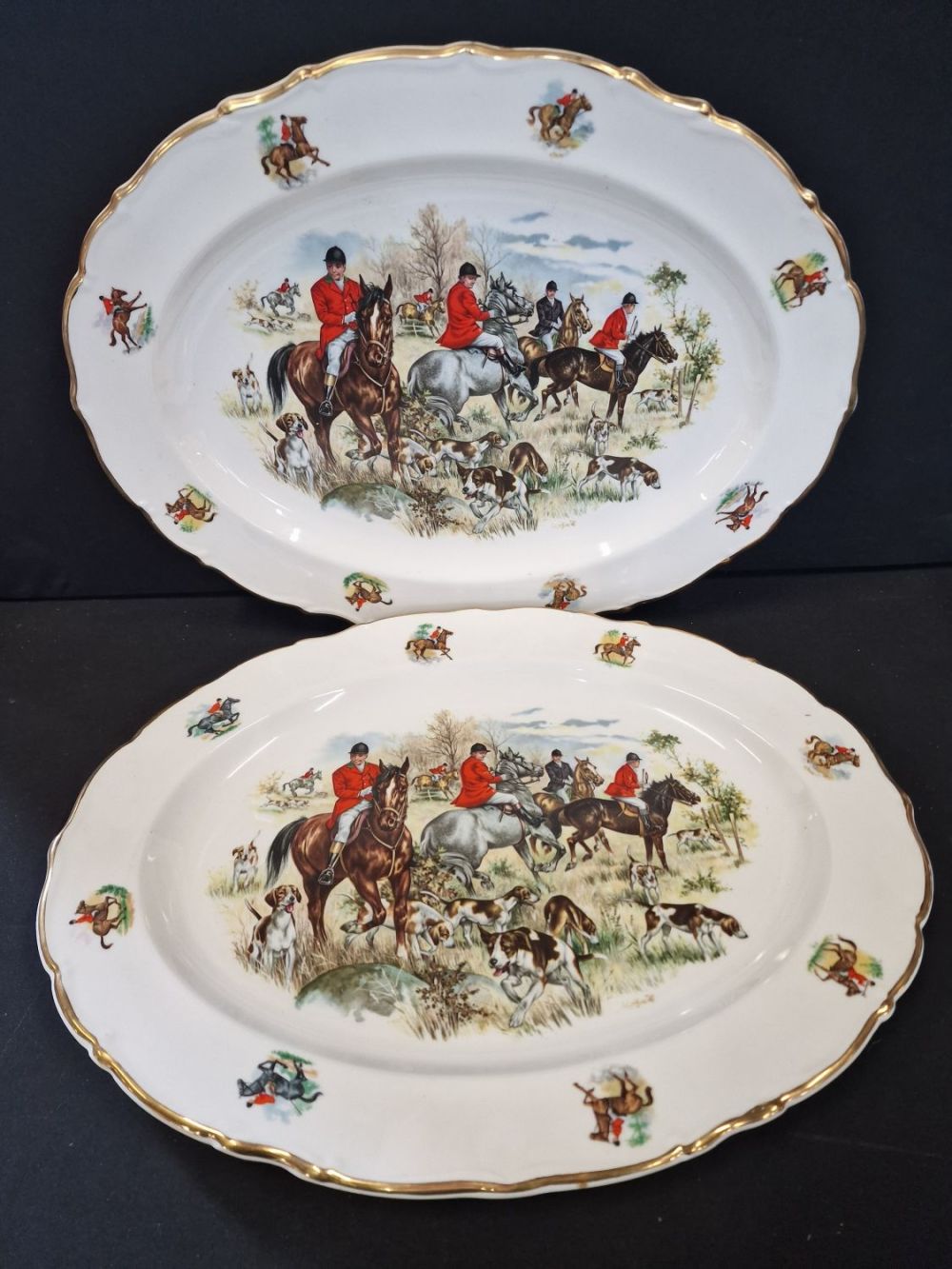 Lot 91: Two large hunting scene china platers. Approximately 16"x12"