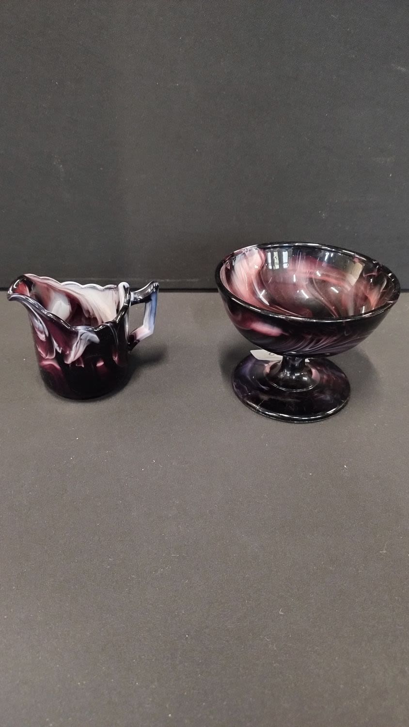 Lot 172: Amethyst milk slag glass dish and milk jug.