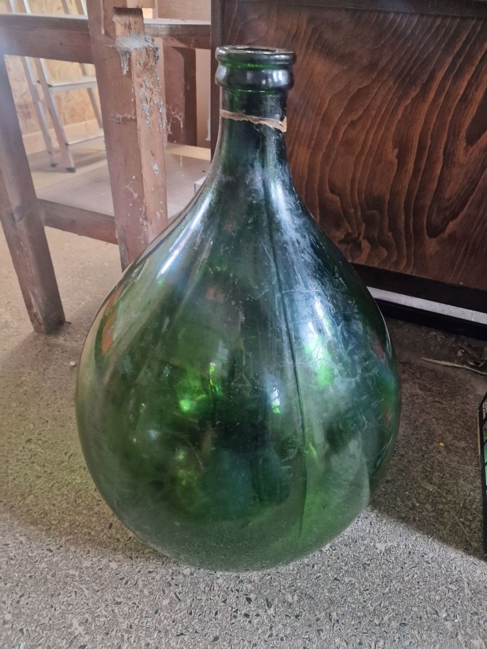 Lot 381: A very large Antique Green Glass Carby Demijohn...