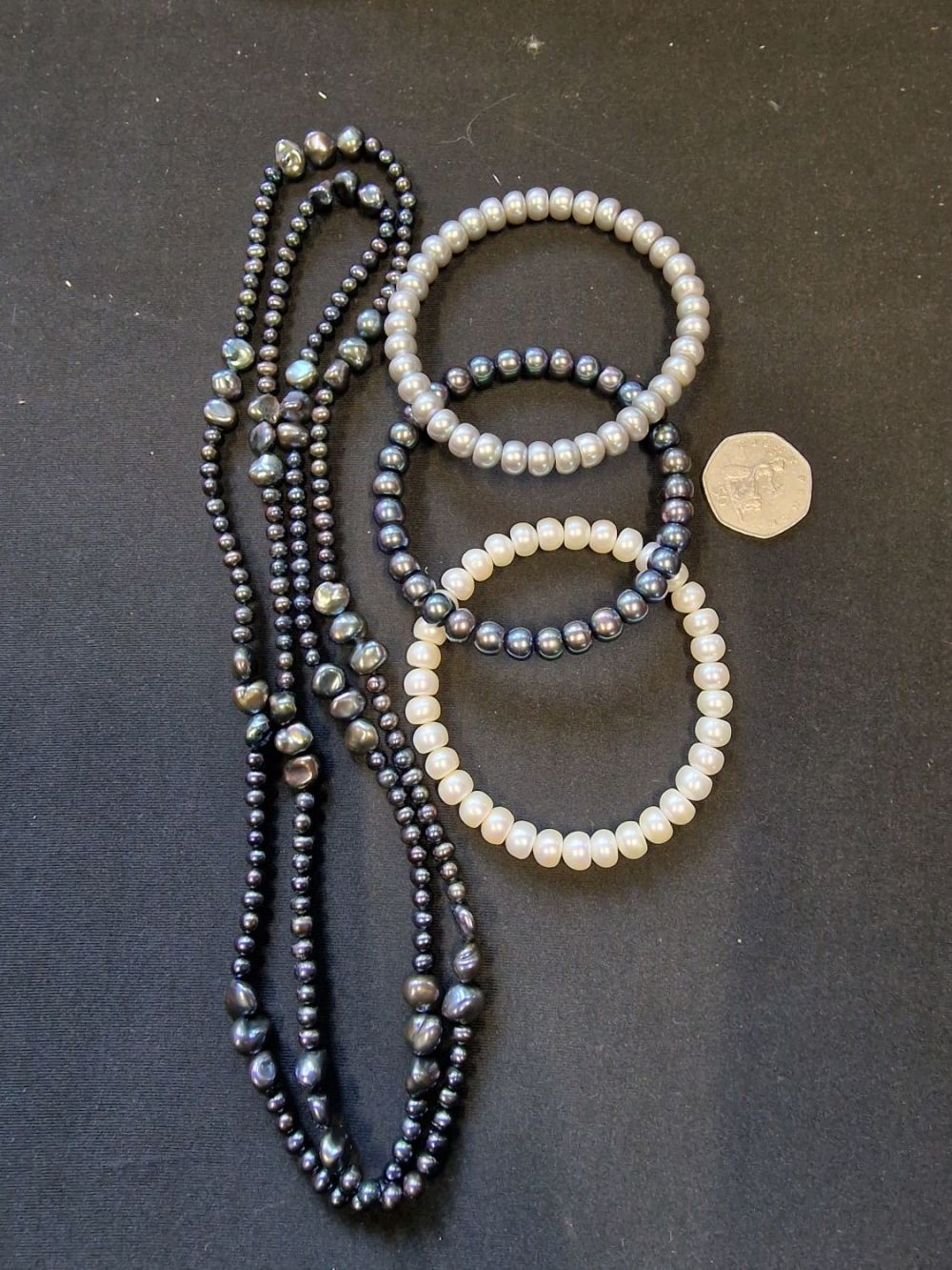 Lot 421: Three cultured pearl bracelets and a long cultured...