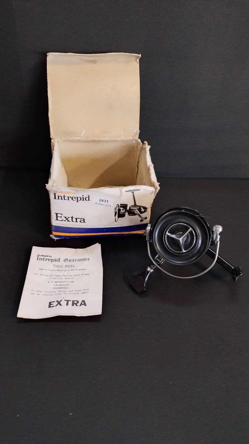 Lot 154: Cladding Intrepid Extra fishing reel with line, black...
