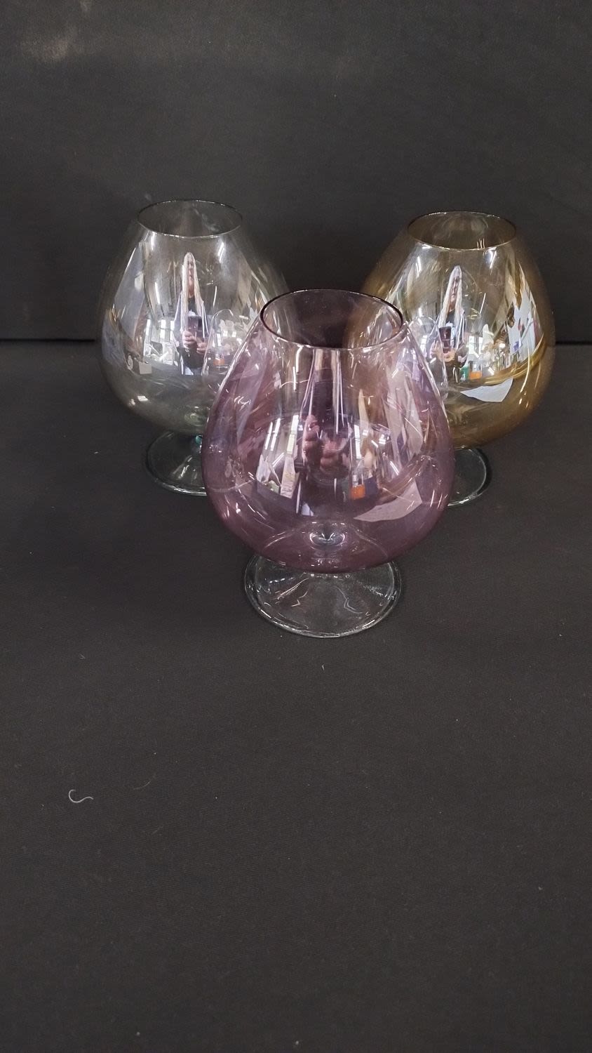 Lot 156: Three coloured brandy glasses, pink, amber and grey.No...