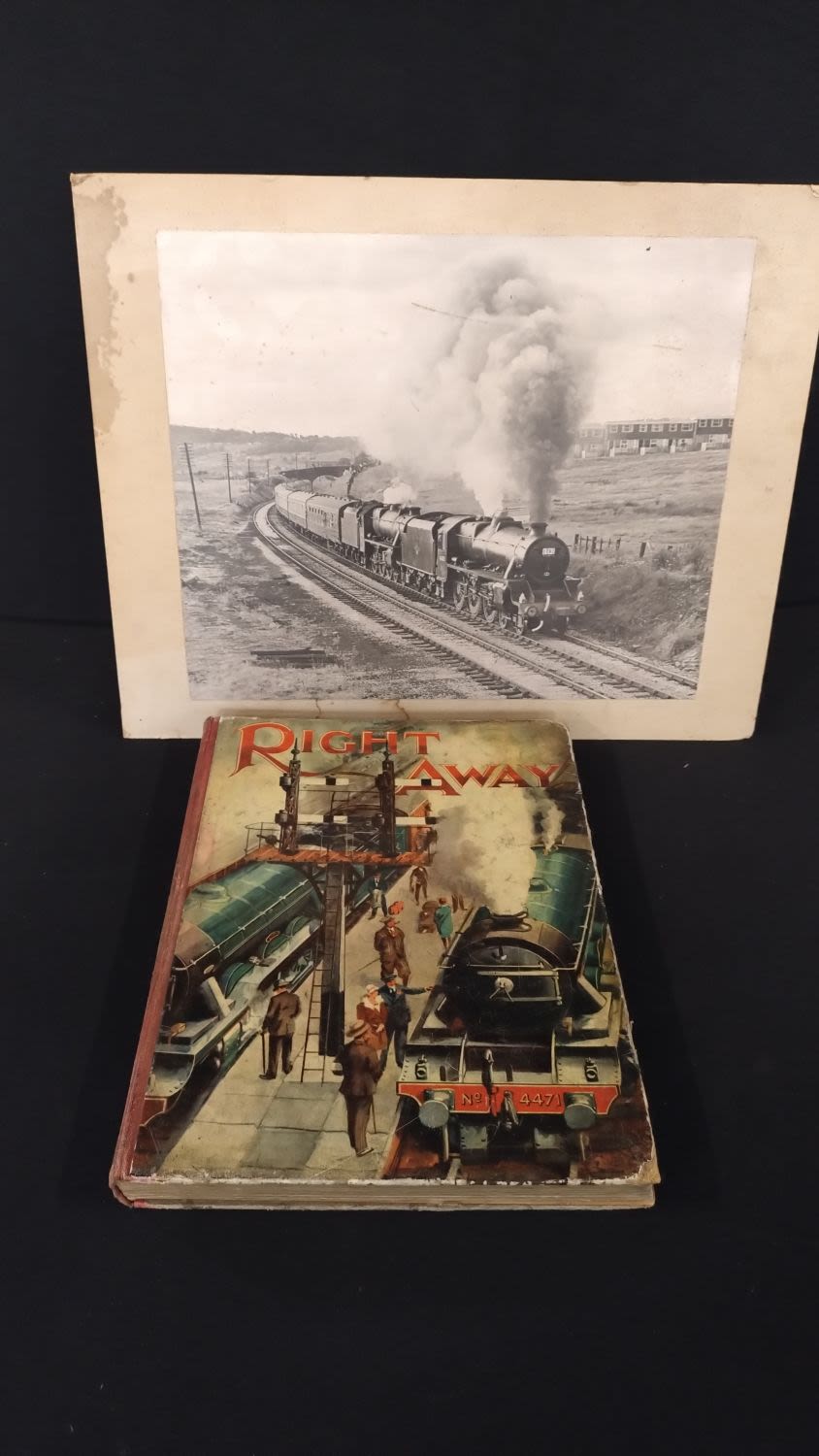 Lot 181: Black and white image of a steam train...
