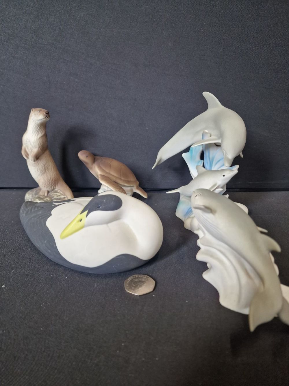 Lot 186: Five piece of HIGHBANK porcelain. Dolphin, whale, duck,...