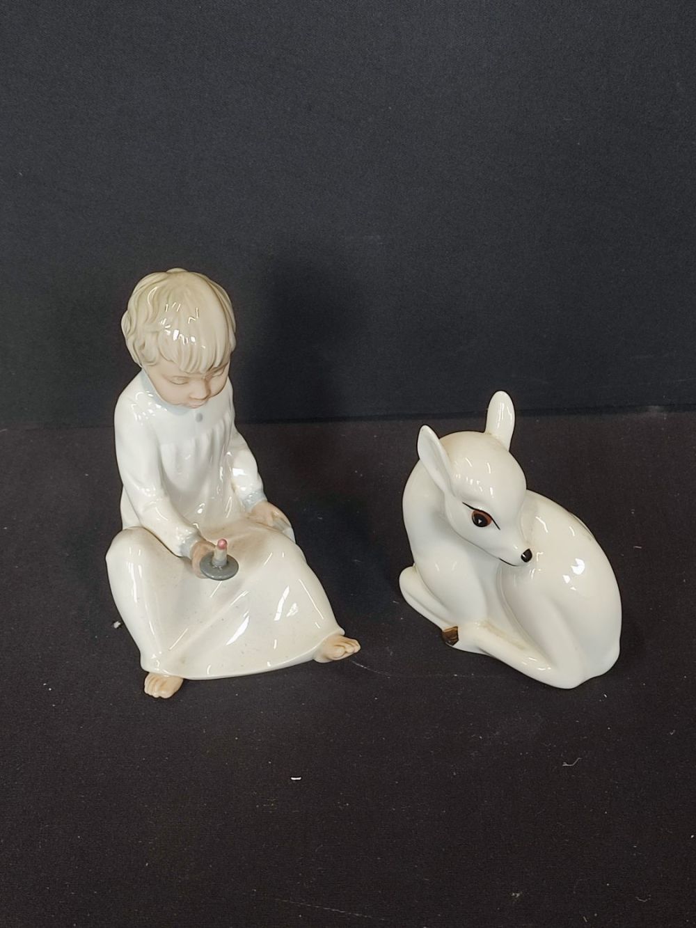 Lot 205: Hand made porcelain NAO by Lladro Sitting boy...