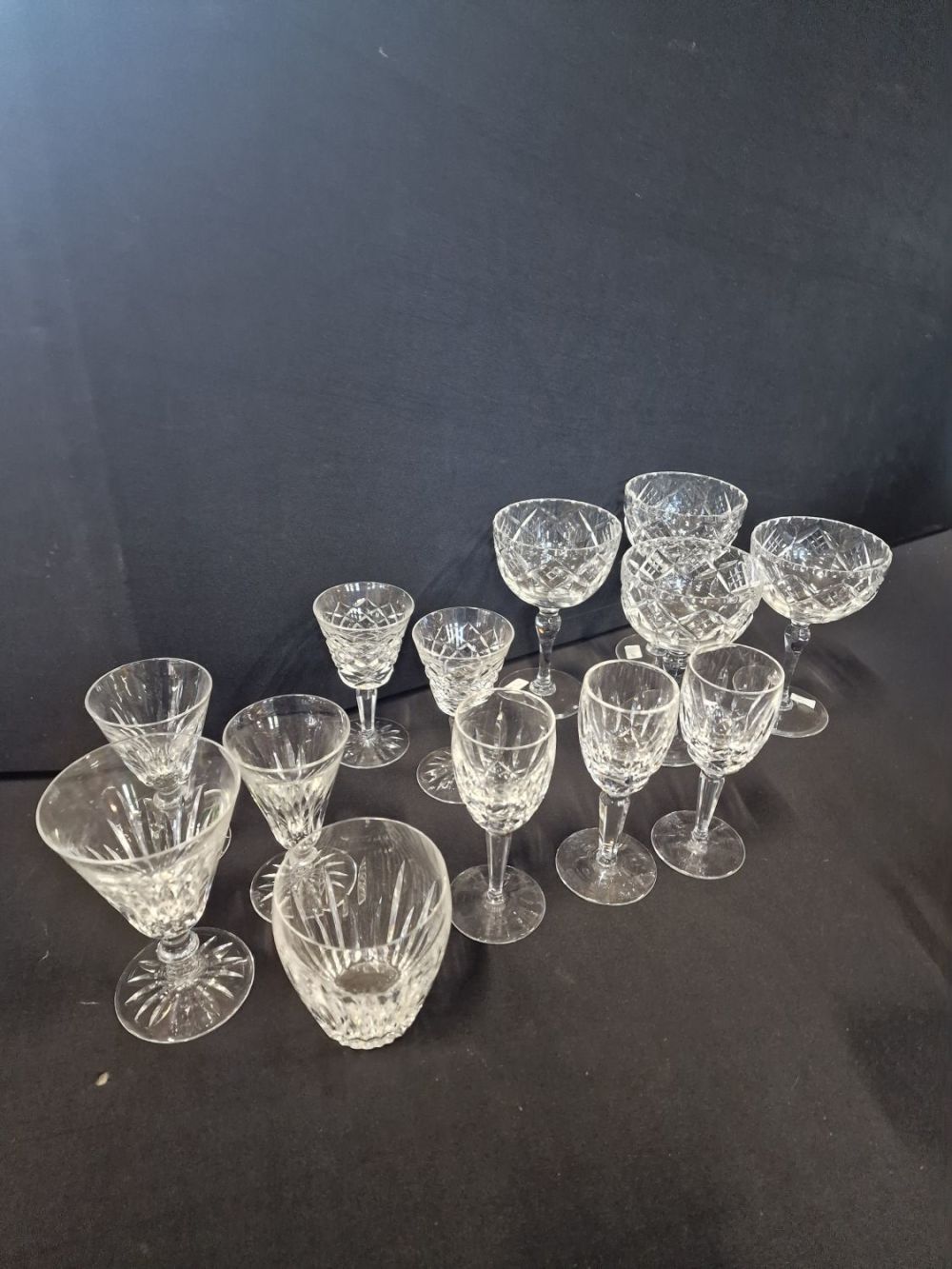 Lot 229: A selection of cut crystal includes two designs...