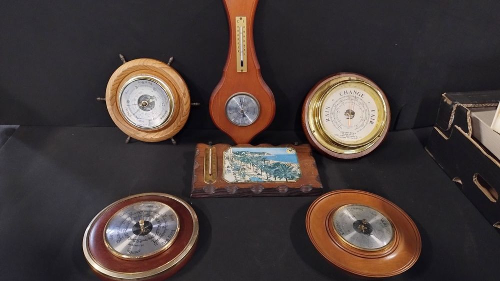 Lot 290: Six various barometers in wood surround some are...