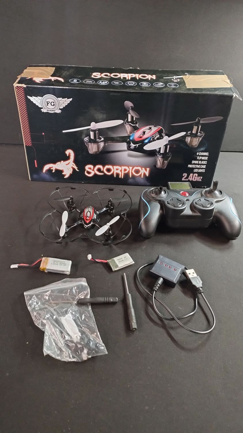 Lot 322: Boxed Scorpion 4 channel 2.4Ghz flip mode drone...