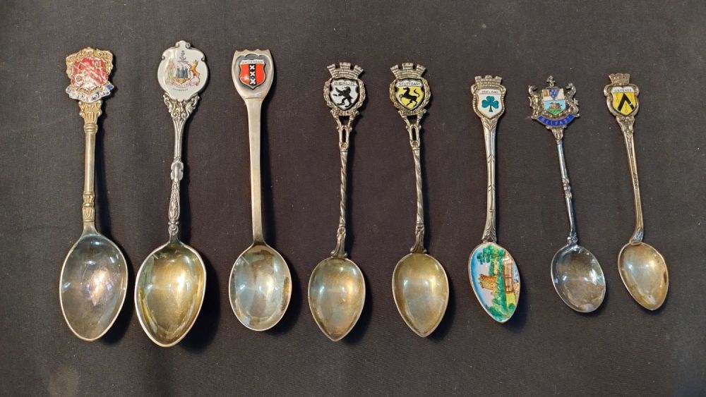 Lot 327: Eight, collectors spoons from various locations, six are...