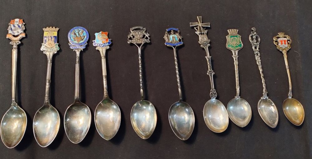 Lot 328: Ten, silver collectors spoons from various locations nine...