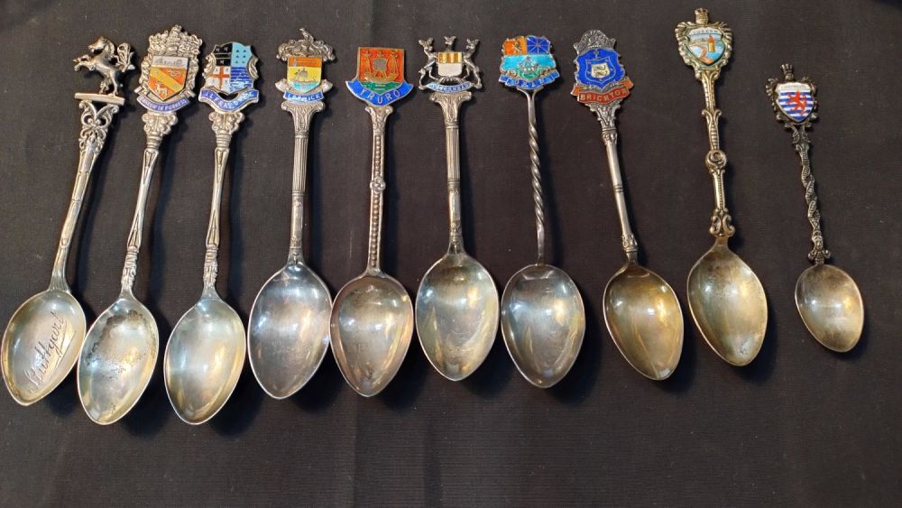 Lot 329: Ten, collectors spoons from various locations. Eight are...