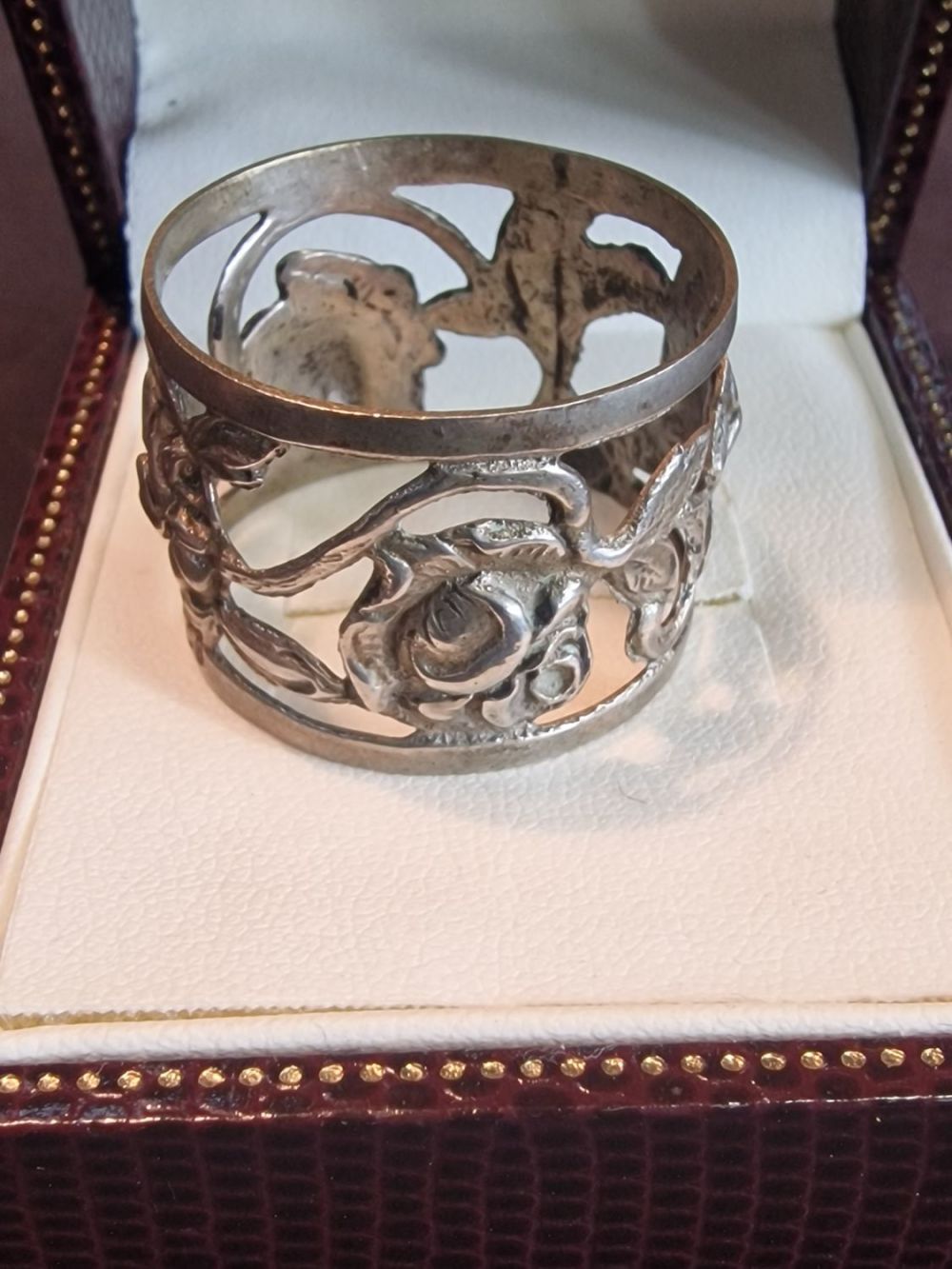 Lot 330: Continental 800 silver bottle cuff with rose detail
