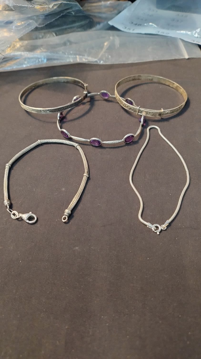Lot 331: Five silver bracelets, one has amethyst stones set...