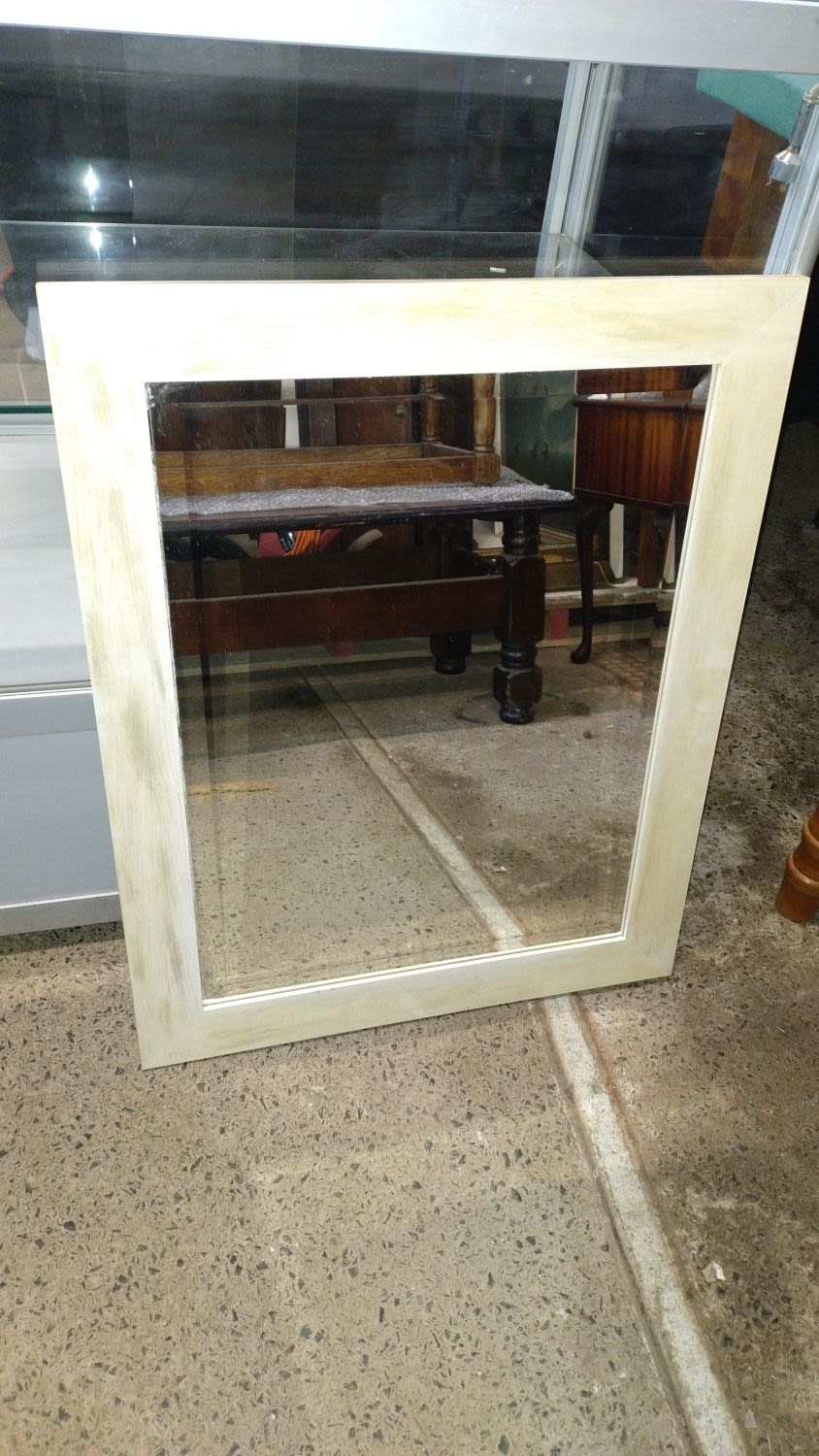Lot 367: bevelled edge mirror in beige and cream