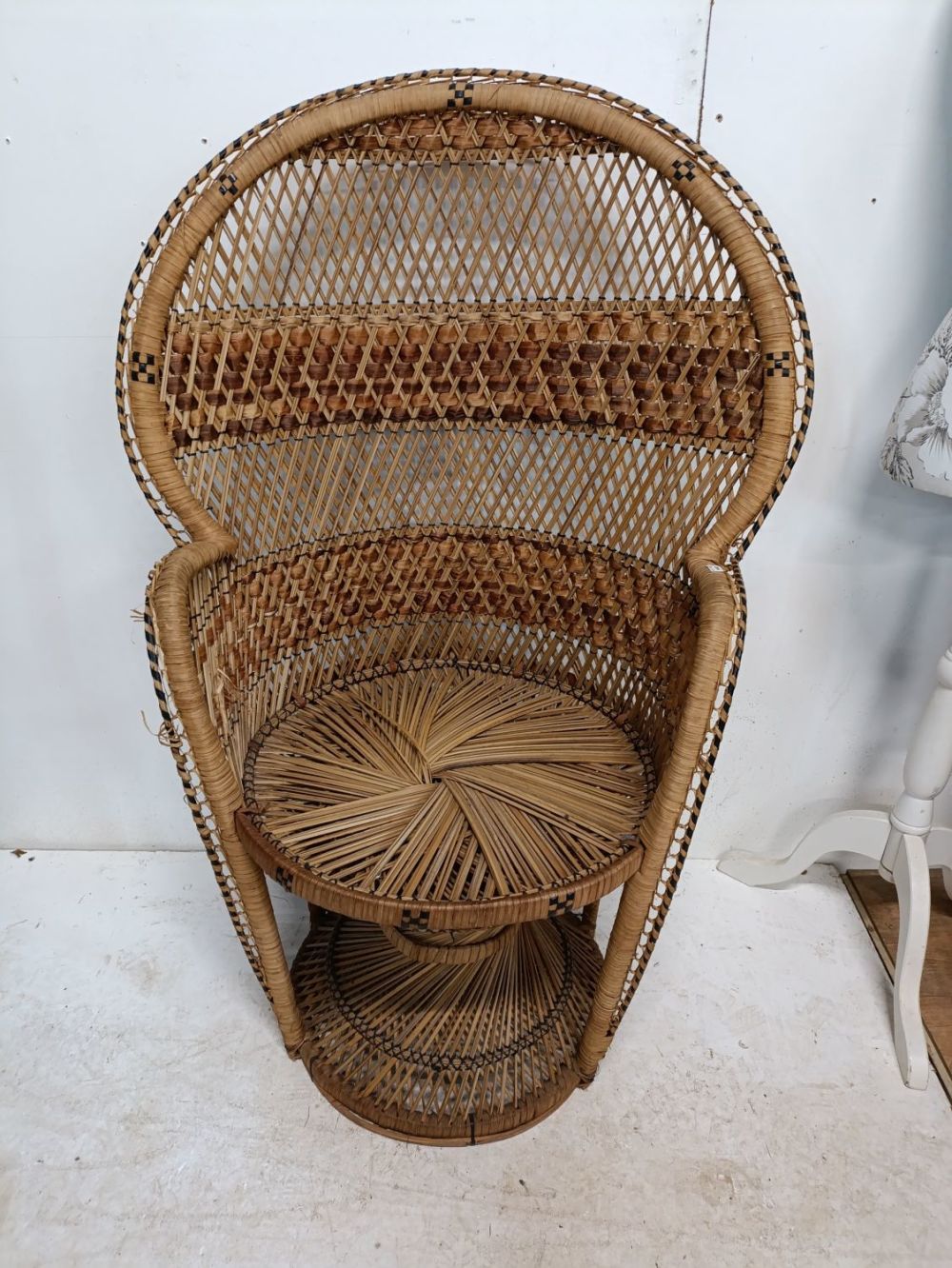 Lot 382: Large vintage peacock wicker chair