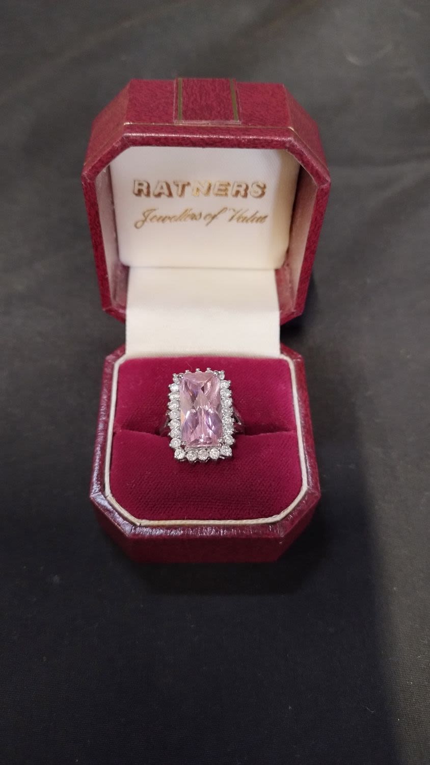 Lot 417: Beautiful pink cubic zirconia central stone surrounded by...
