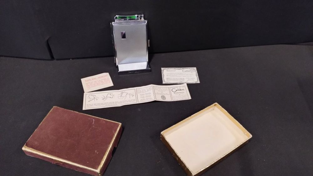Lot 430: Boxed, Vintage calibre cigarette holder with lighter enclosed...