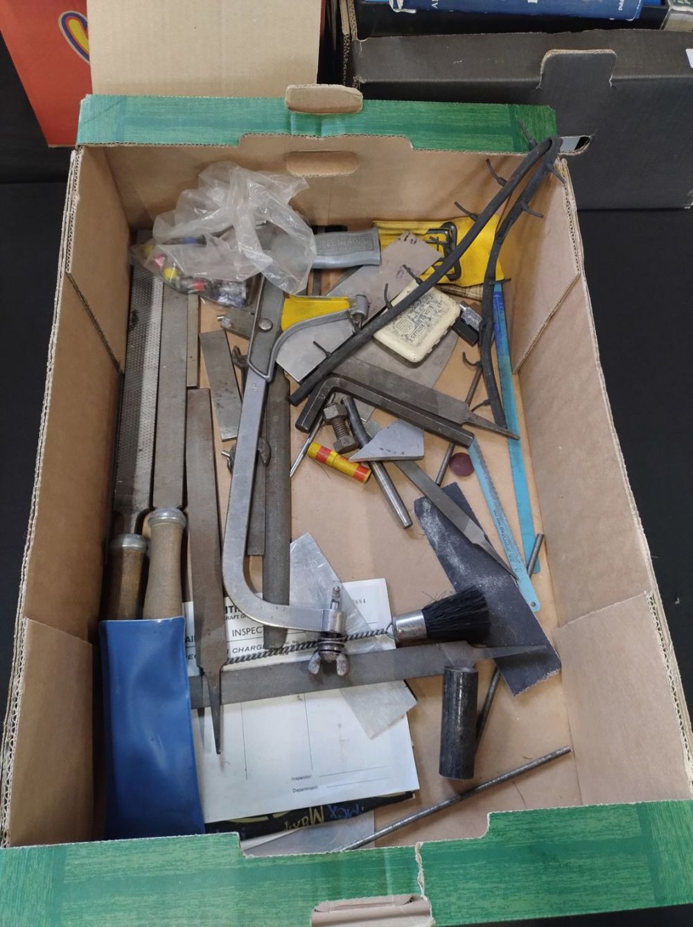Lot 469: Box of mixed hand working files, large hacksaw...