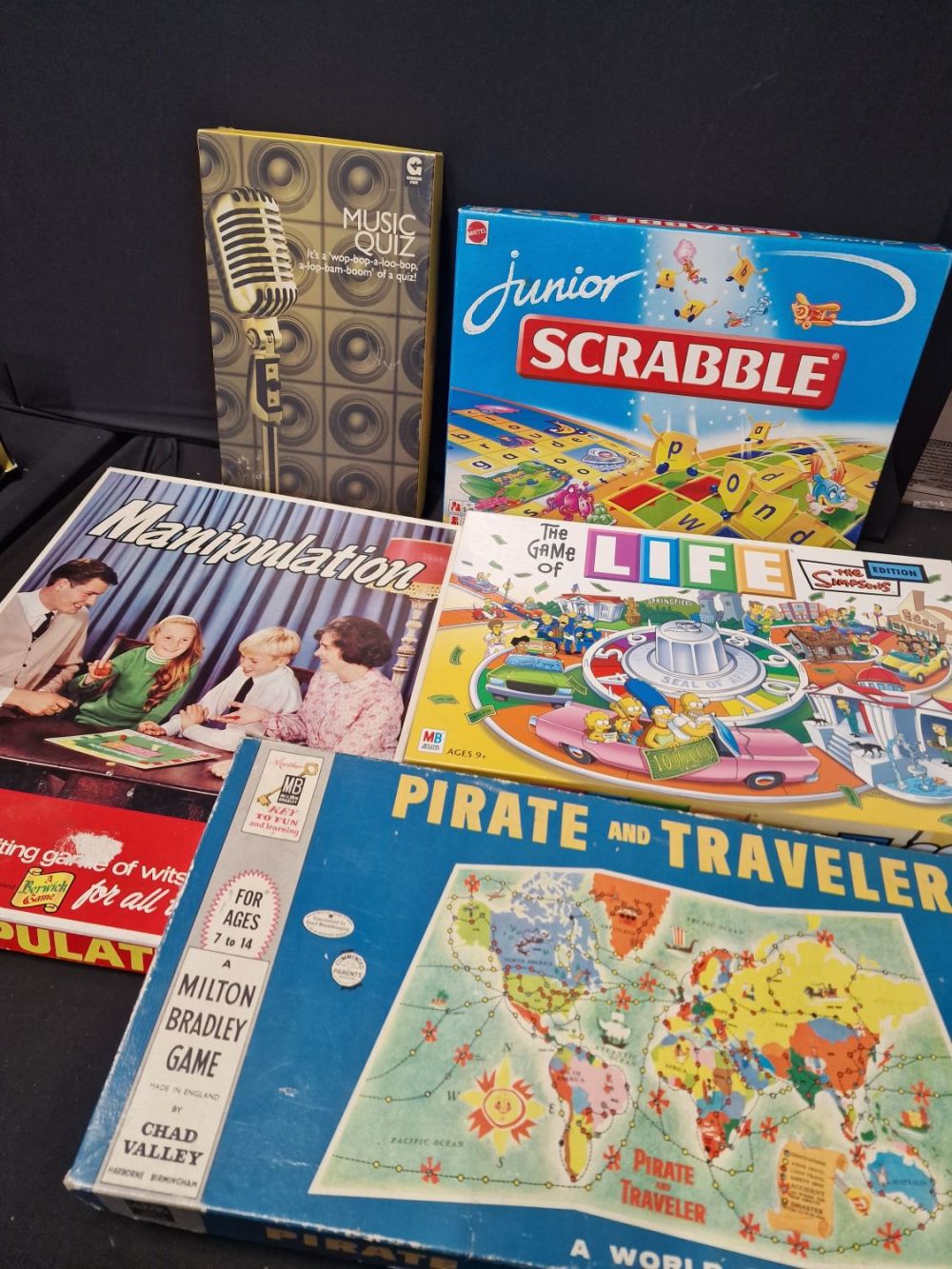 Lot 498: A collection of five vinatge games. Includesntirate and...