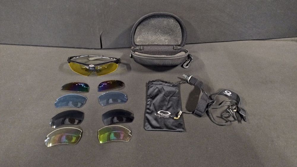 Lot 499: Pair of OAKLEY shades with four interchangeable lenses,