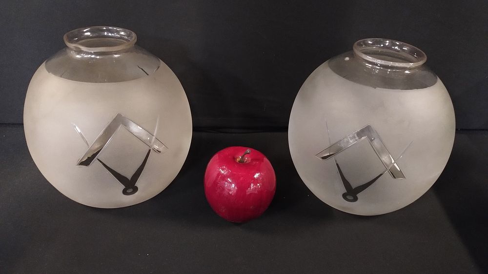 Lot 264: Two masonic light shades with a masonic decoration...