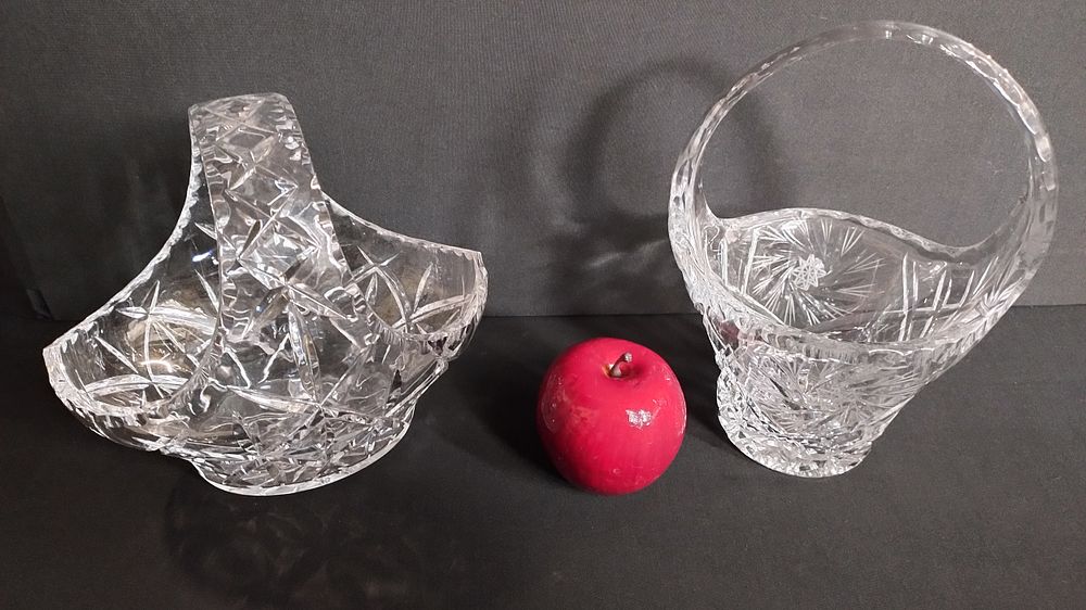 Lot 397: Two cut crystal handled bowls one has started...