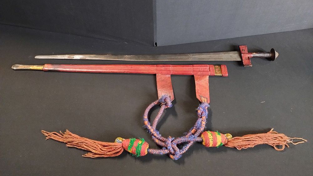 Lot 406: Possible Tuareg Takouba sword has brass inlay decoration...