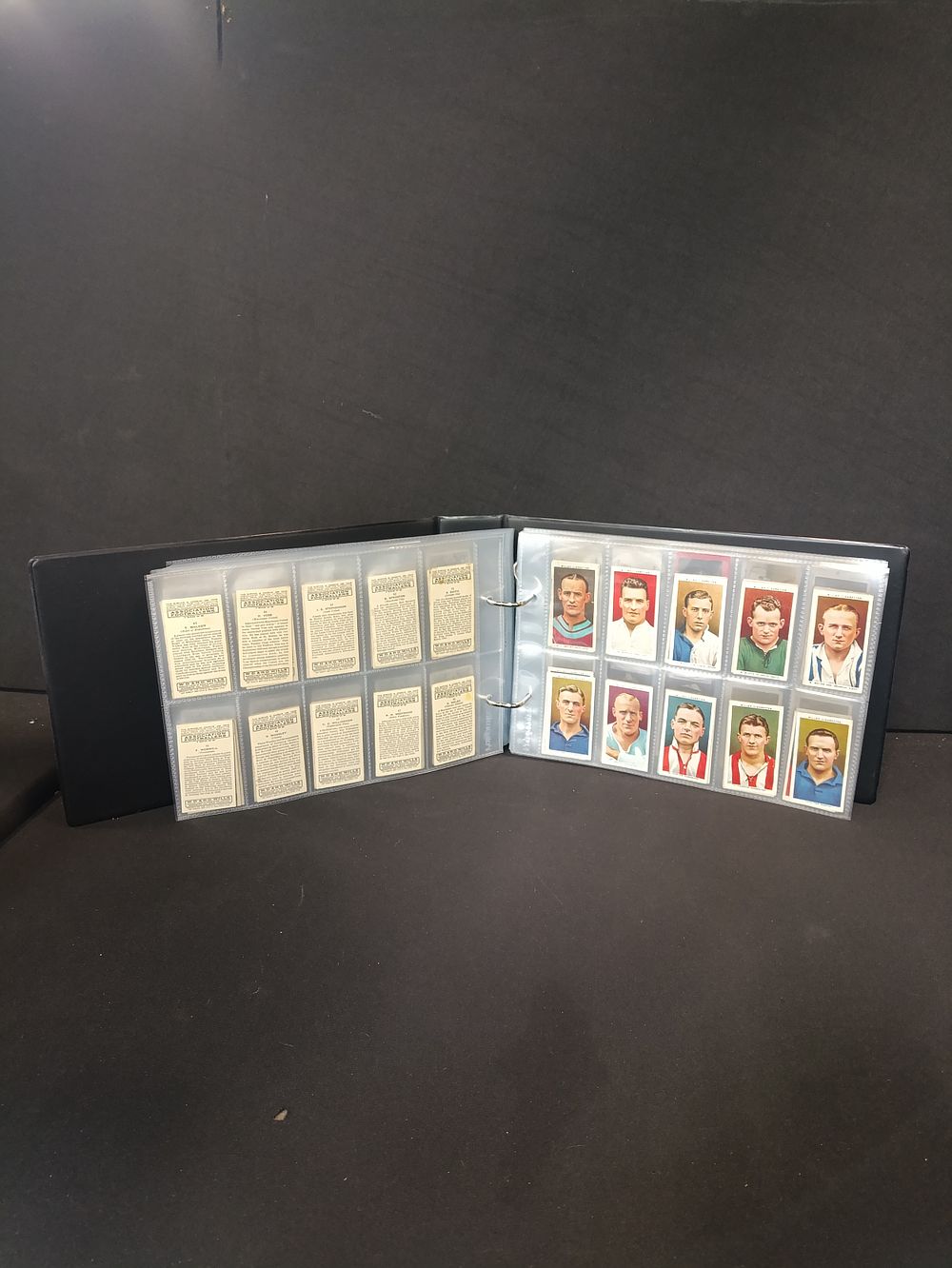 Lot 426: Collection of approximately 600 cigarette cards in ring...