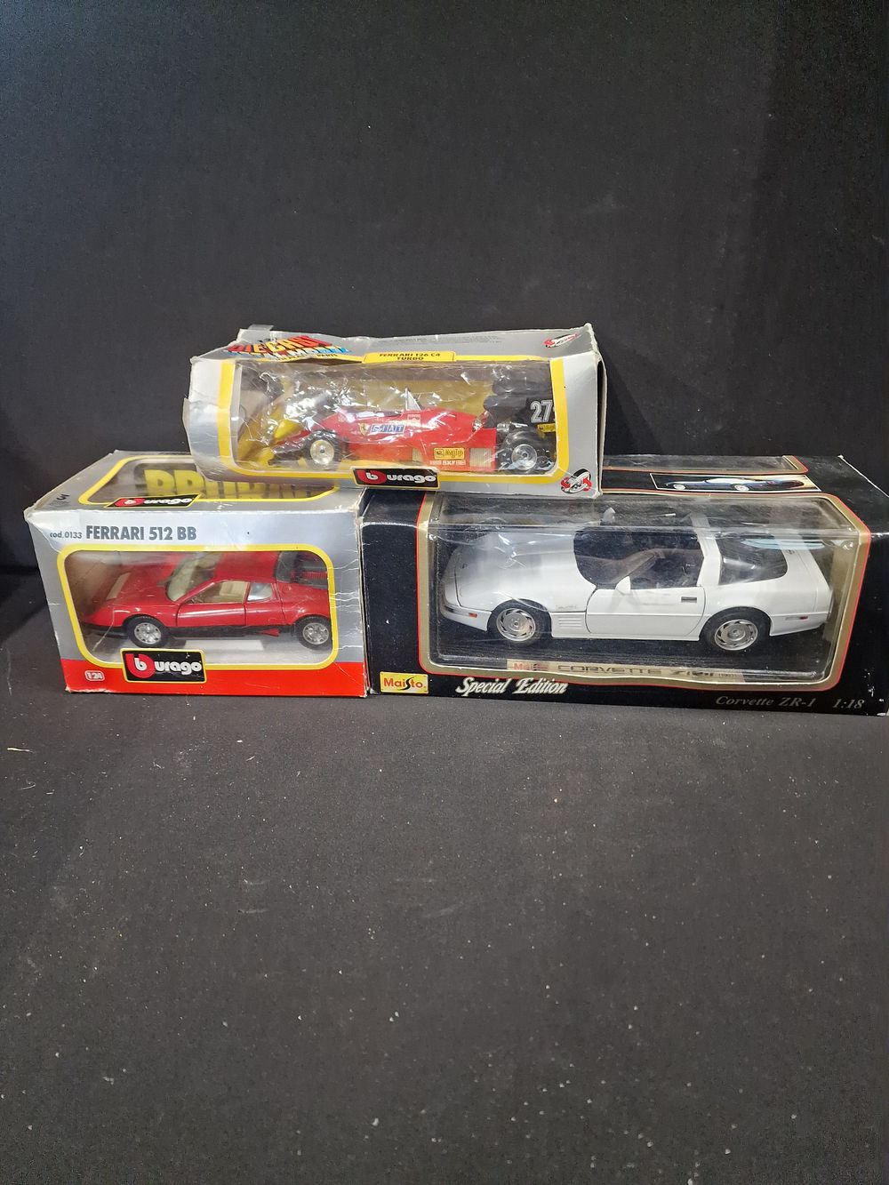 Lot 153: Three vintage Bburago and Maisto collectable cars. Includes...