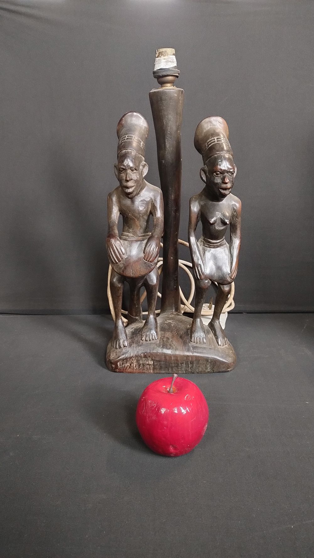 Lot 237: A Africana lamp base, features male and female...