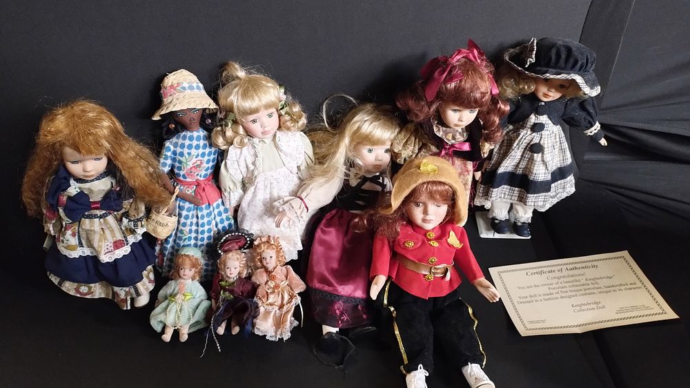 Lot 249: Various porcelain dolls, one handmade doll one key...