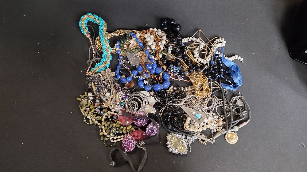 Lot 270: Bag of costume jewellery including beaded necklaces and...